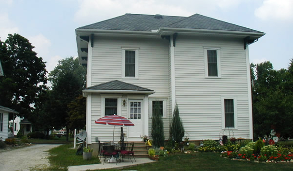 home with white siding and white door